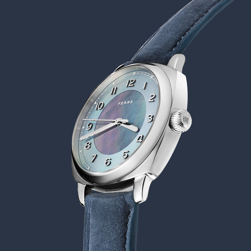 An angled view of the Aurora’s cushion case and mother-of-pearl dial.
